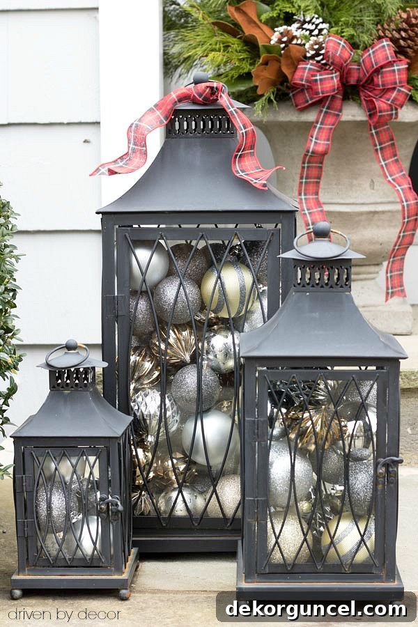 Christmas home tour - a set of lanterns filled with ornaments used as simple front porch Christmas decorations