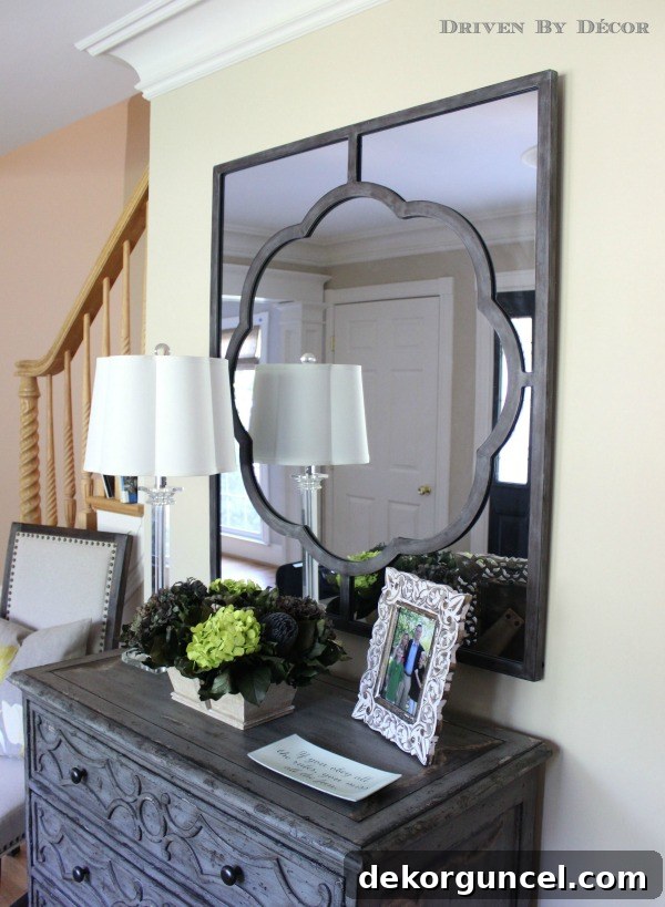 Our Foyer's Stunning Transformation 4 Beautiful Gabby Home Dupont mirror elegantly placed over a foyer chest of drawers