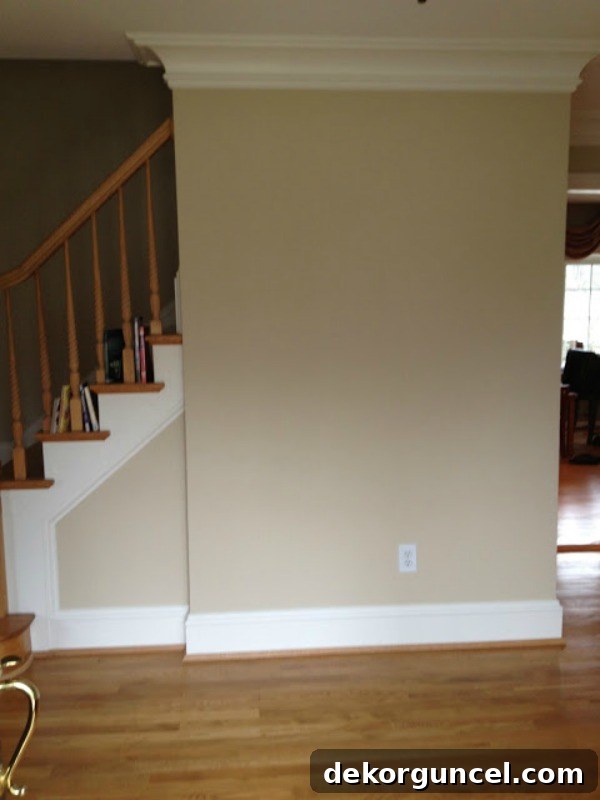 The "before" of the foyer showing an empty and unadorned space