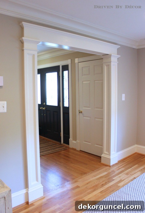 Our Foyer's Stunning Transformation 7 Architectural molding and columns added to a standard doorway, significantly enhancing its appearance and character