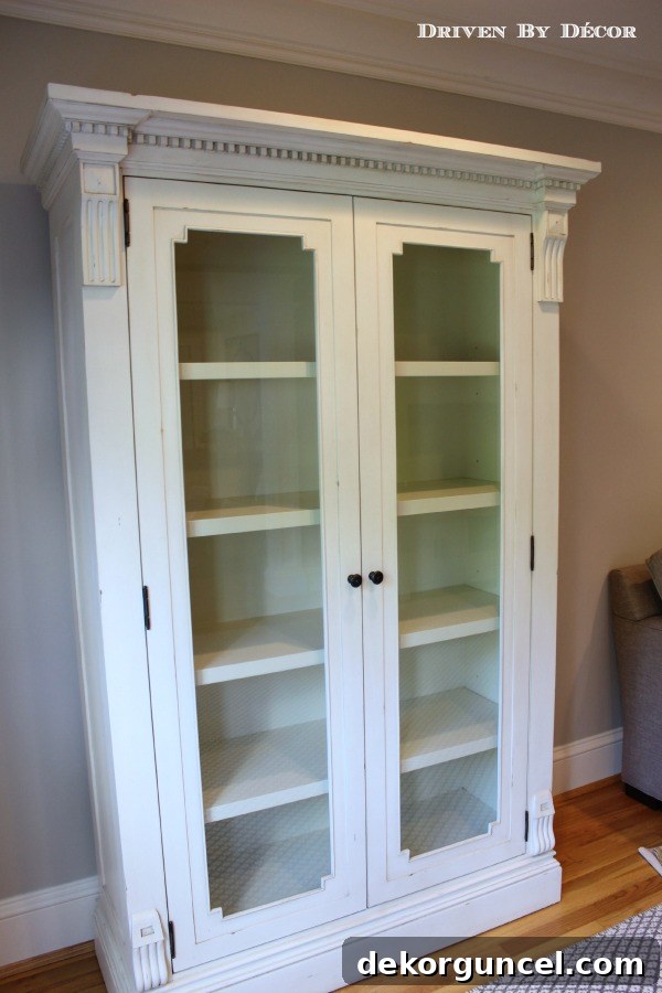 Our Foyer's Stunning Transformation 9 Restoration Hardware St. James Glass Double-Door Cabinet in a stunning antiqued white finish