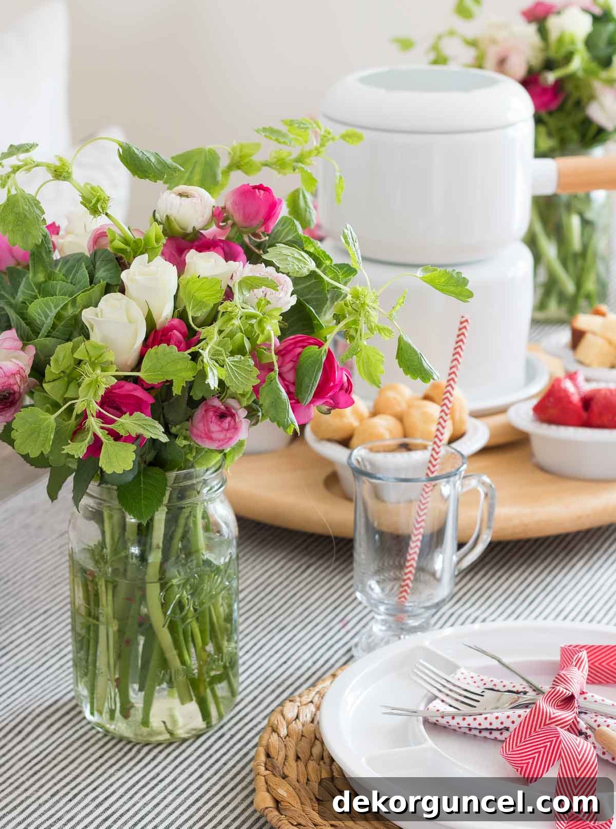 The Art of Fondue Table Presentation 6 Beautiful bouquet of fresh flowers serving as a centerpiece on a table set for fondue dinner