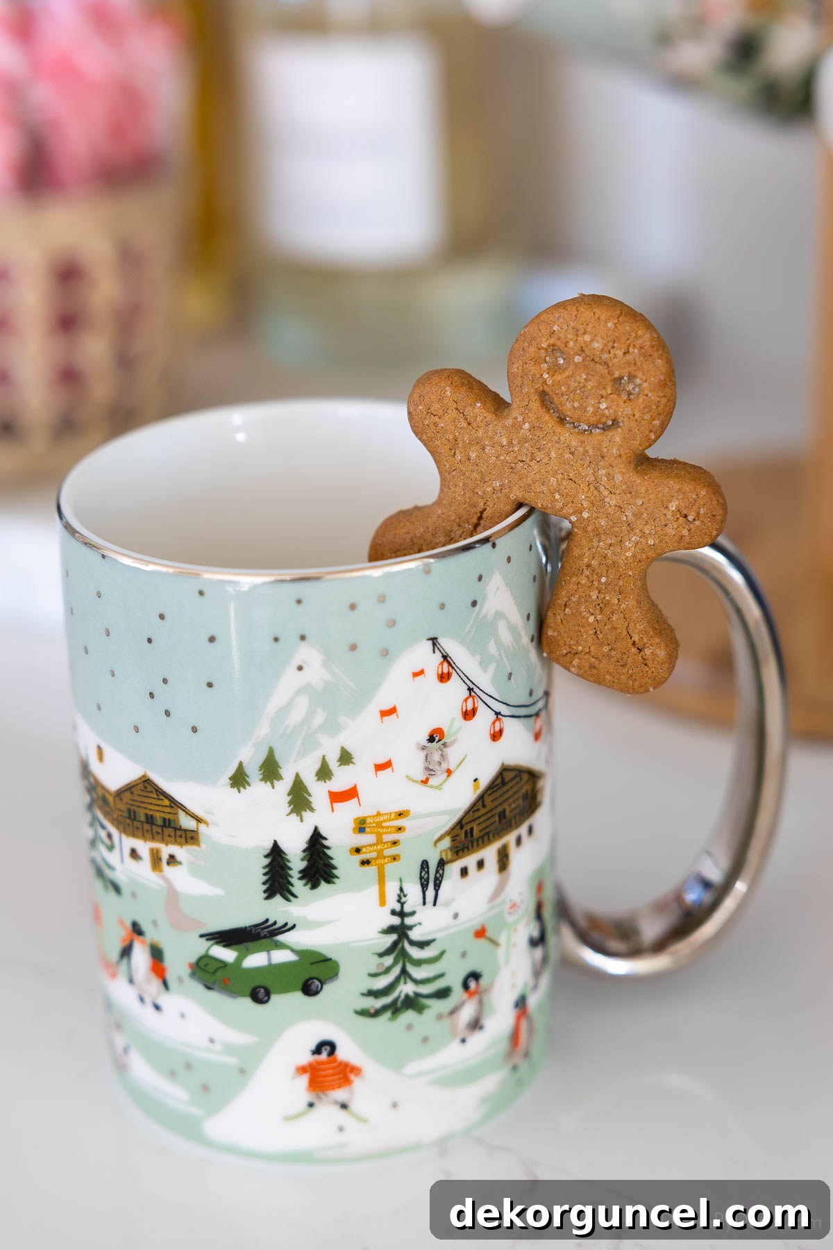 Gingerbread mug hangers on edge of coffee mug