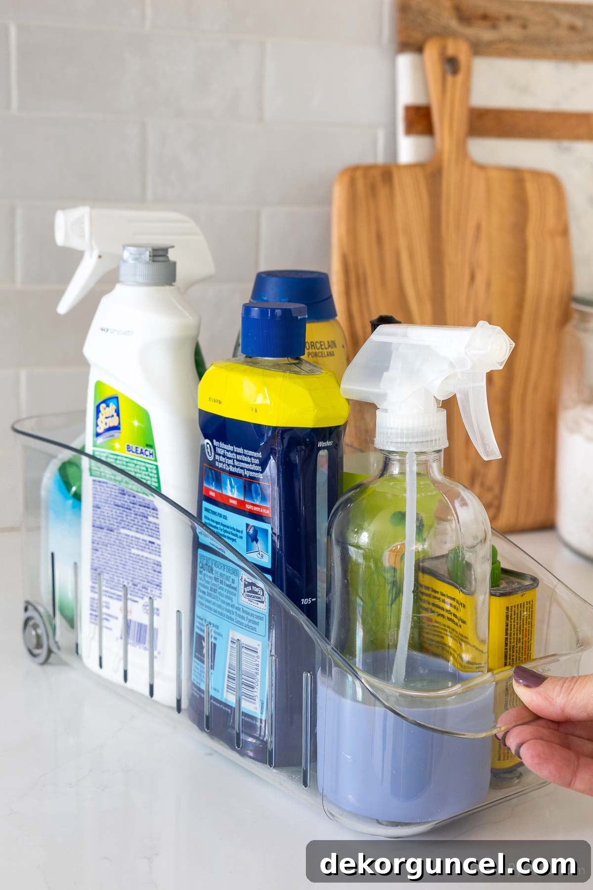 Organizing Under the Kitchen Sink: A Guide to a Tidy Space 11 Rolling organizer holding cleaning supplies.