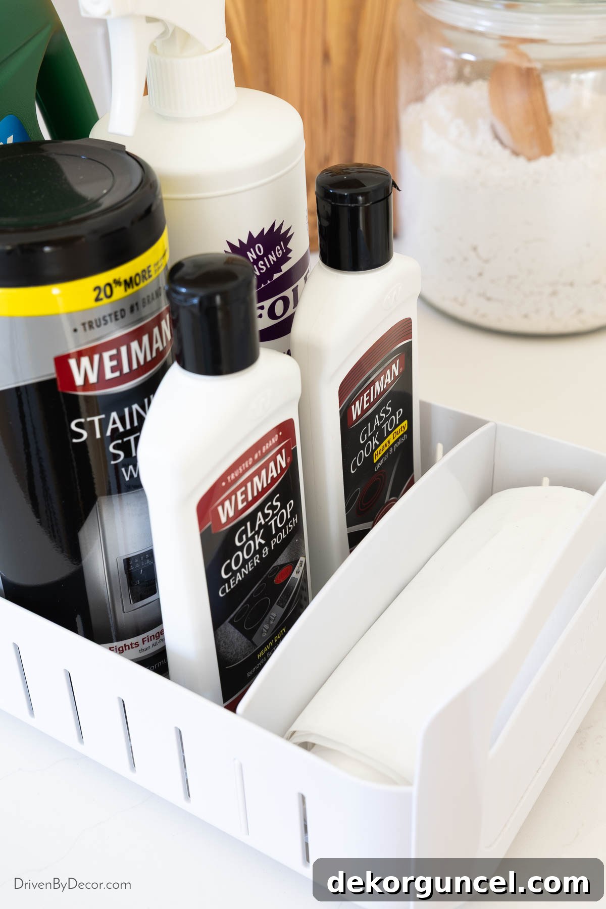 Organizing Under the Kitchen Sink: A Guide to a Tidy Space 13 Adjustable dividers in a rolling organizer holding cleaning supplies.