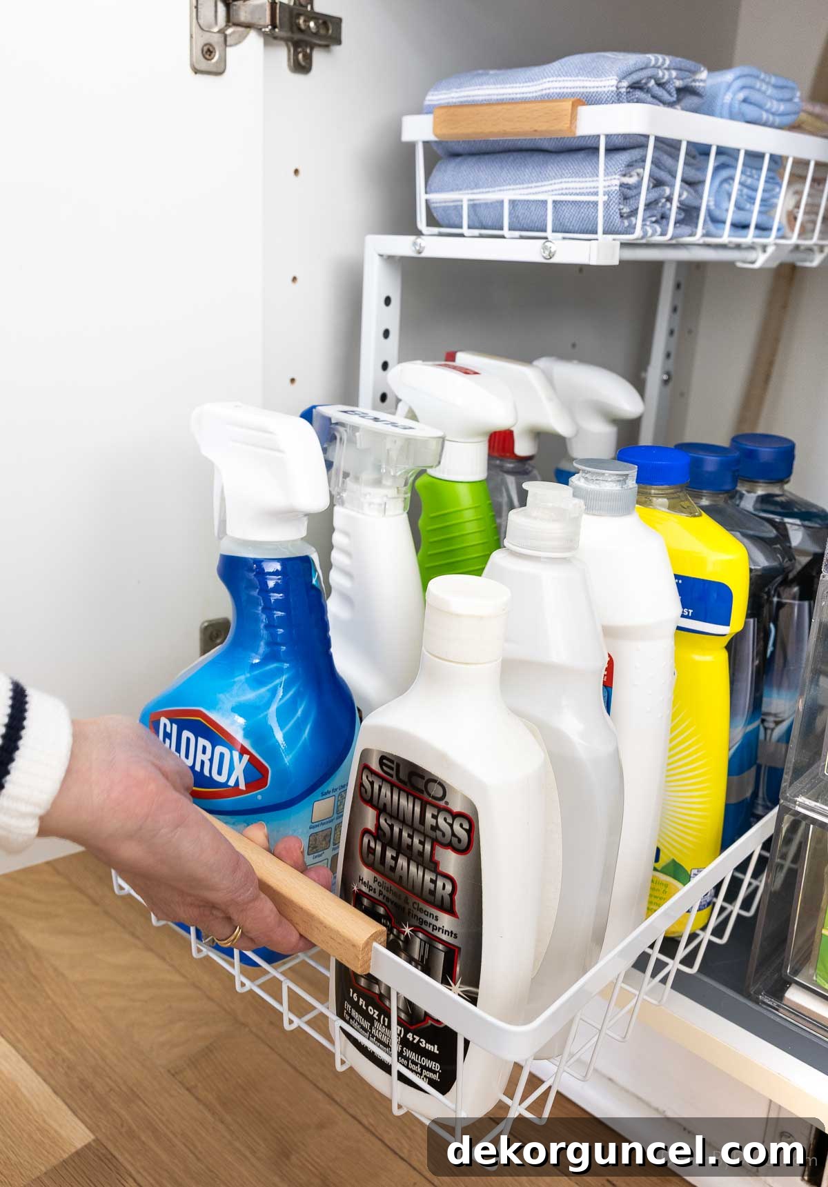 Organizing Under the Kitchen Sink: A Guide to a Tidy Space 8 Tiered under-sink organizer with a drawer being pulled out, showcasing easy access to items.