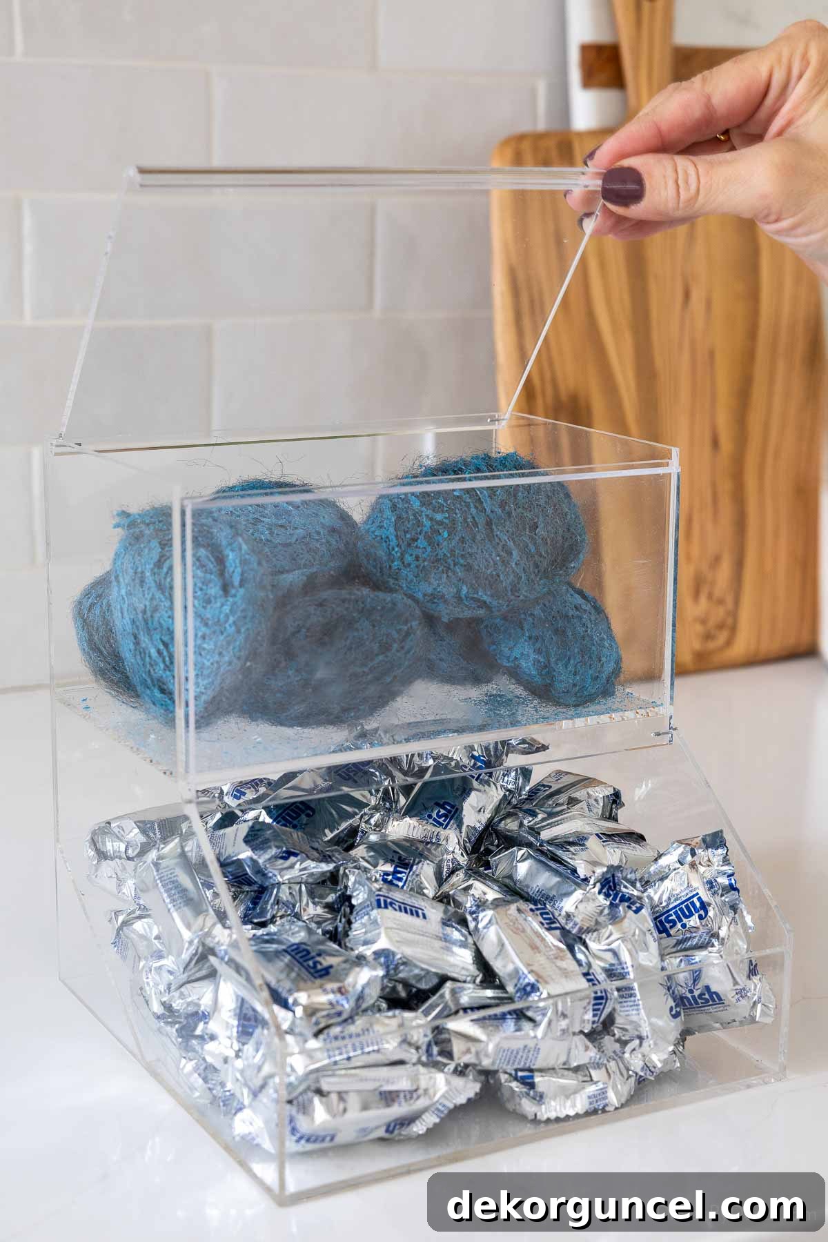 Organizing Under the Kitchen Sink: A Guide to a Tidy Space 9 Acrylic organizer for dishwasher pods and soap pads.