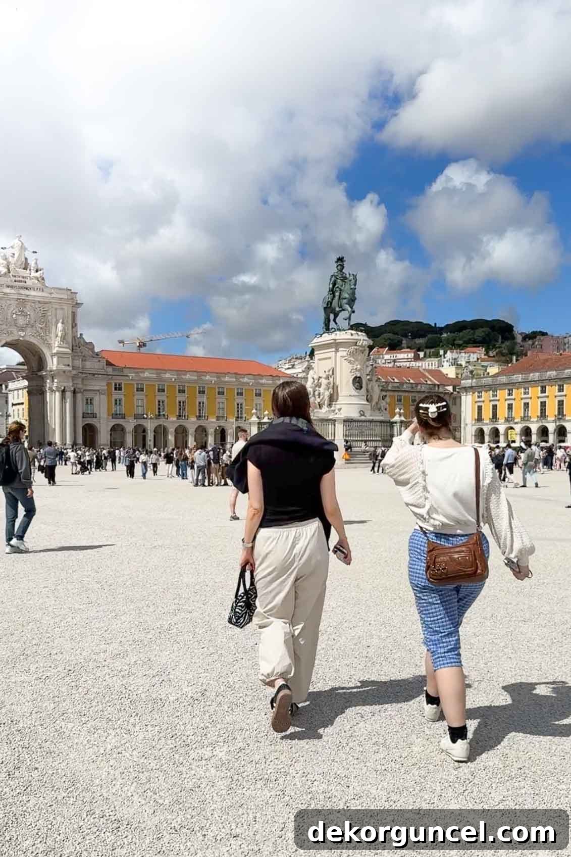 Family Trip to Portugal: Where We Stayed, Ate and Explored 11 Two women strolling in Praca Do Comercio in Lisbon