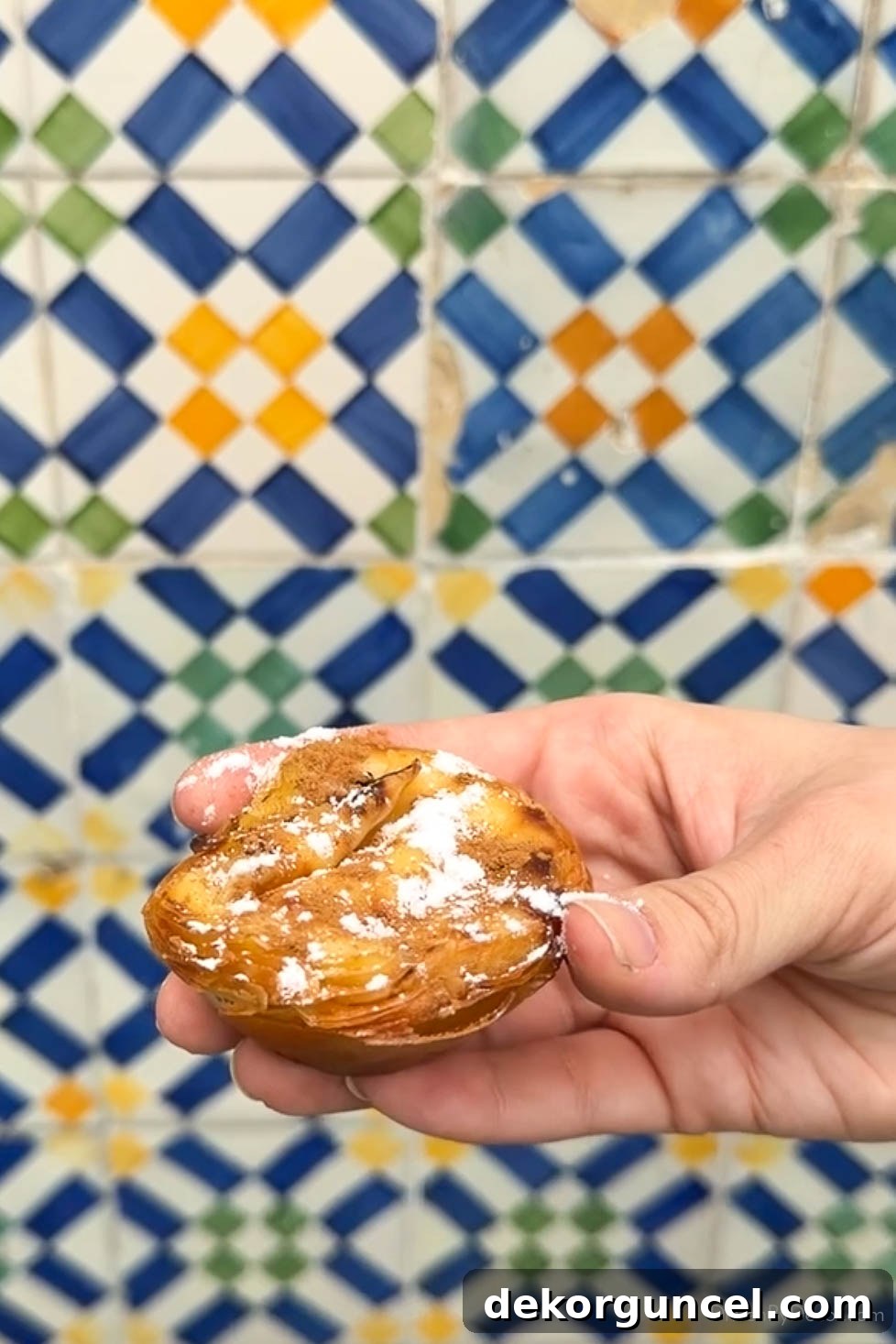 Family Trip to Portugal: Where We Stayed, Ate and Explored 15 Pastel de nata pastry in front of tiled wall