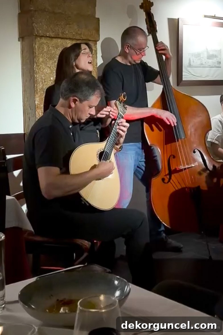 Family Trip to Portugal: Where We Stayed, Ate and Explored 22 Woman vocalist and two men on string instruments performing Fado music