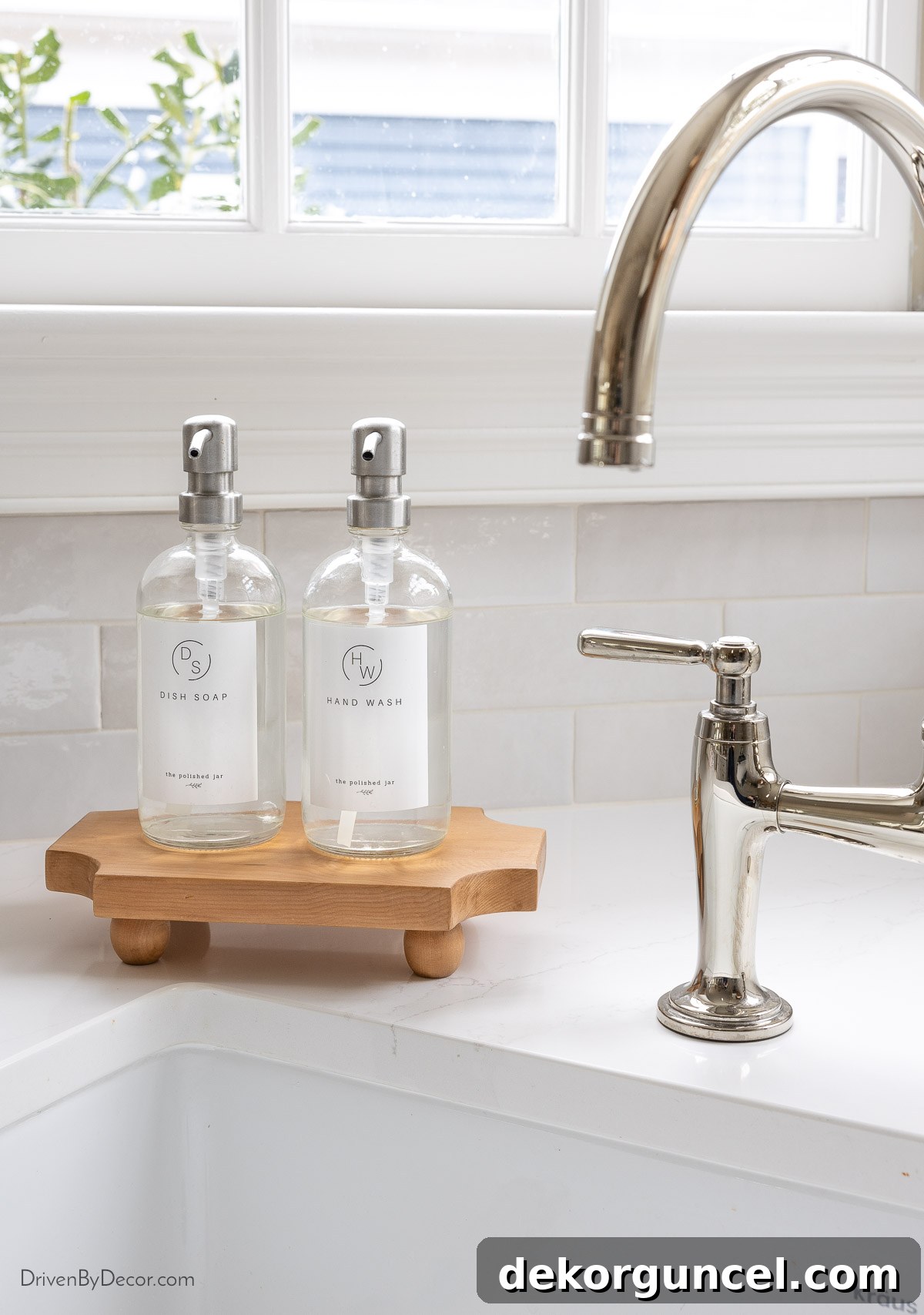 Small Budget, Big Impact: 50 Home Updates Under $50 3 Kitchen soap pumps on wood stand next to sink